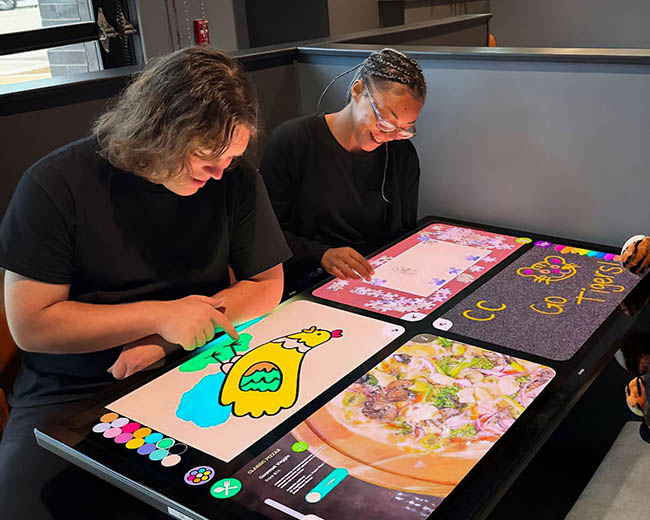 People using smart dining table